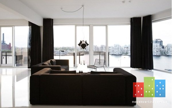 black-furniture-on-modern-a-house-sofa-and-curtains.jpg